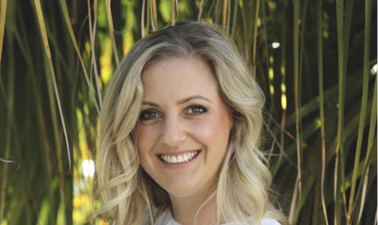 A portrait of Ikecho CEO and founder Erica Miller taken against greenery